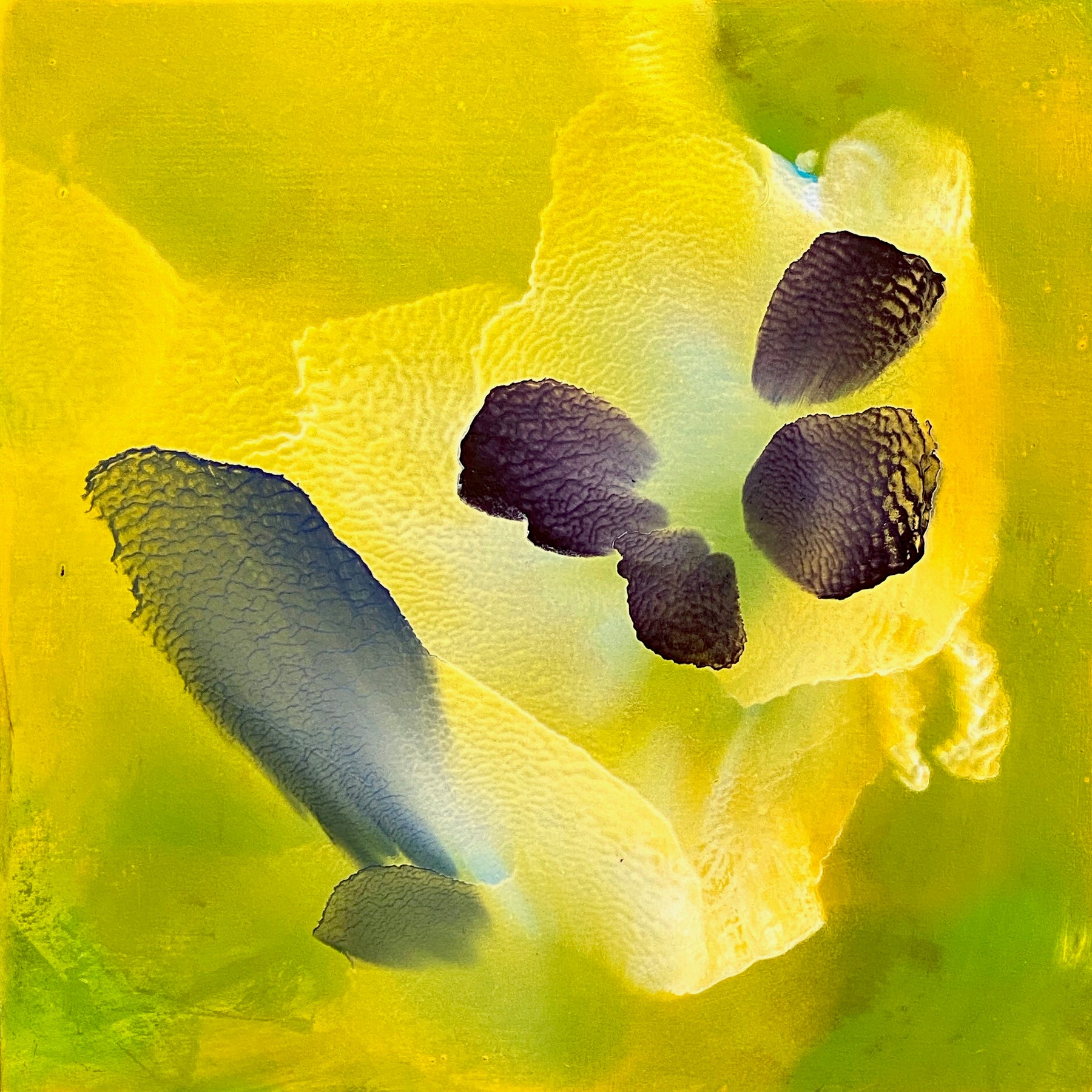 Abstract oil painting of a yellow flower-like figure by Usha Shukla.